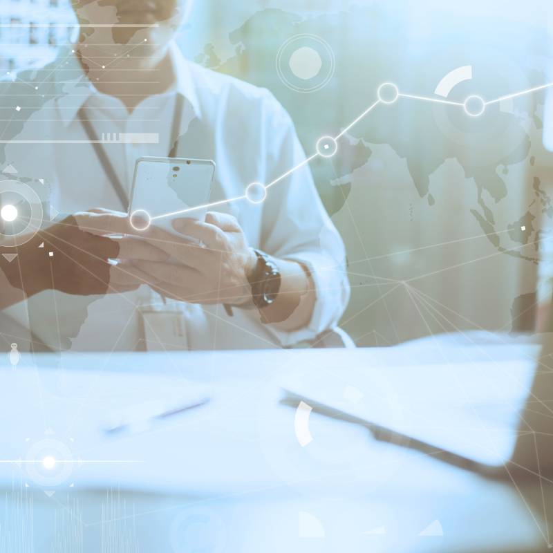 a doctor is sitting at a desk with a laptop